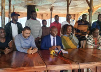 Lawyer Stanley Okecho Speaking to the media (Middle) together with affected residents. PHOTO URN