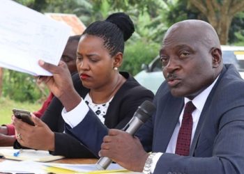 LC V Chairman Erastus Kibirango and MP Brenda Nabukenya presiding over a meeting to resolve the land dispute on Monday. PHOTO URN