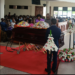 Ex-PM Rugunda lays wreath on the casket containing remains on Kirasha yesterday at St Andrews Church, Bukoto.