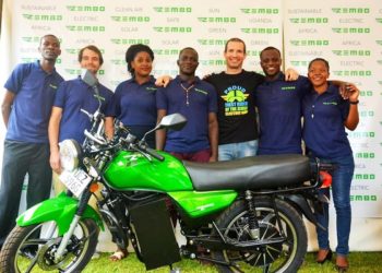 Zembo team with an electric motorcycle.