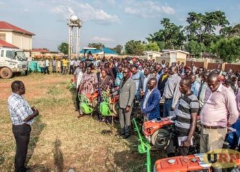 Alebtong District officials receiving the tractors at the District Headquarters. PHOTO URN