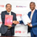 Varghese Thambi, Managing Director, Diamond Trust Bank and TerraPay’s Muyingo after signing the deal