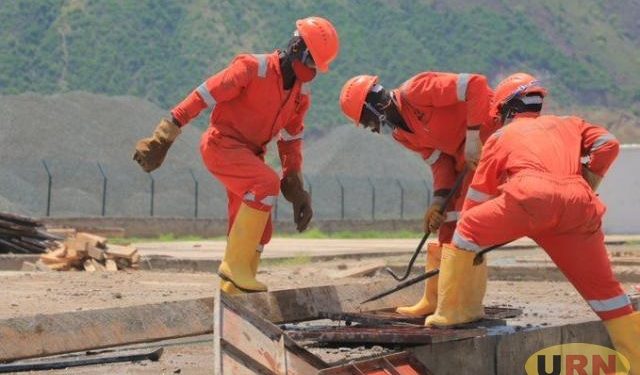 Oil and gas workers at Kingfisher in Kikuube district. Earnings from this sector will make Uganda among the contributors to projected growth. PHOTO URN

 