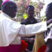 Archbishop Emeritus John Baptist Odama consoles a christian shortly after announcing his retirement on March 22 2024 at St Joseph’s Cathedral in Gulu City. PHOTO URN
