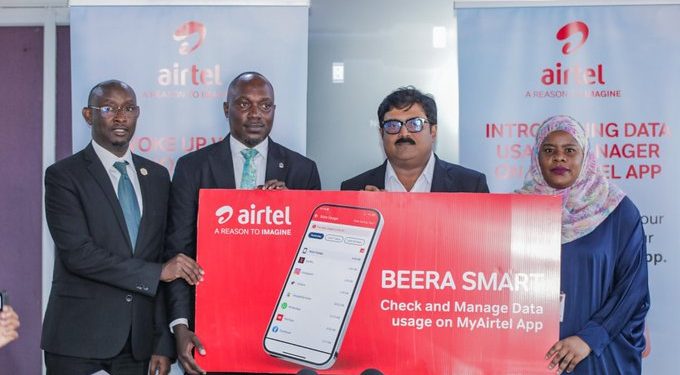 Airtel Uganda’s Managing Director, manoj murali (2nd R), Head of Information Technology and Security, Uganda Communications Commission(UCC), Michael Bamwesigye (2nd L), Customer Experience Director at Airtel Uganda, Joweria Nabakka (R), Public and Corporate Communications Manager at Airtel Uganda, David Birungi (L) unveiling a Data Usage Manager, a feature on the MyAirtel App, that shows users how much data is used on their devices and by what application. The innovation was launched at the Airtel Head Office at Clement Hill Road.