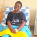 Dorothy Namukasa one of the beneficiaries her knee was replaced by an implant after surgery at Mulago hospital. PHOTO URN