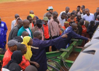 Farmers being shown different farm equipments at Asili Farm