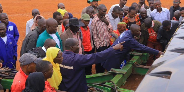 Farmers being shown different farm equipments at Asili Farm