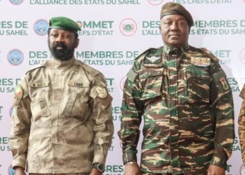 The head of head of Niger’s military government General Abdourahmane Tchiani (R) and Malian Col. Assimi Goita (L) pose for a photo as they arrive in Niamey on July 6. AFP