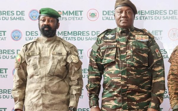 The head of head of Niger’s military government General Abdourahmane Tchiani (R) and Malian Col. Assimi Goita (L) pose for a photo as they arrive in Niamey on July 6. AFP