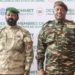 The head of head of Niger’s military government General Abdourahmane Tchiani (R) and Malian Col. Assimi Goita (L) pose for a photo as they arrive in Niamey on July 6. AFP