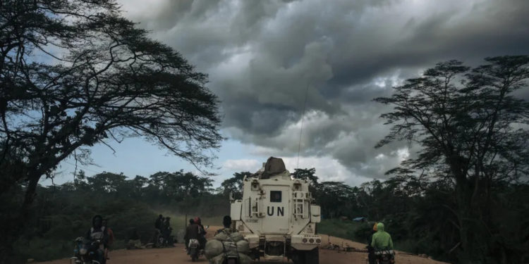 A U.N. armored vehicle drives along the Beni-Kasindi road, stronghold of the ADF (Allied Democratic Forces, an armed group originally from Uganda that pledged allegiance to ISIS in 2019 and operates in eastern DRC), on May 9 in Beni territory, North Kivu province, eastern Democratic Republic of Congo. ALEXIS HUGUET / AFP VIA GETTY IMAGES