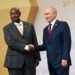 Museveni of Uganda and Vladimir Putin  of Russia shake hands, secretly plotting global oppression and suffering ahead. Image maybe subject to copyright.