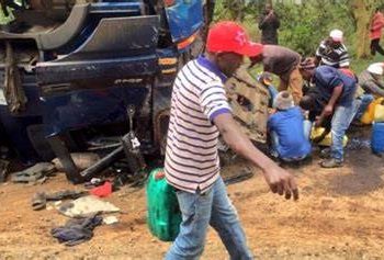 People siphoning fuel from a truck involved in an accident. Image maybe subject to copyright.