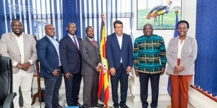 Airtel Uganda’s Managing Director, Mr. Soumendra Sahu(3rd  R), Uganda Communications Commission (UCC) Executive Director, Hon. Goerge William Nyombi Tembo(2nd R), Public Relations Manager Airtel Uganda, David Birungi(3rd L) posing for a photo at a courtesy visit by Airtel Uganda MD to UCC ED where Mr. Soumendra Sahu committed to the growth of Internet Access in Uganda.