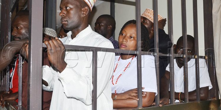 Four of the thirty-two National Unity Platform supporters in the dock have been released on sh500, 000 cash bail by the General Court Martial in Kampala. Image maybe subject to copyright.